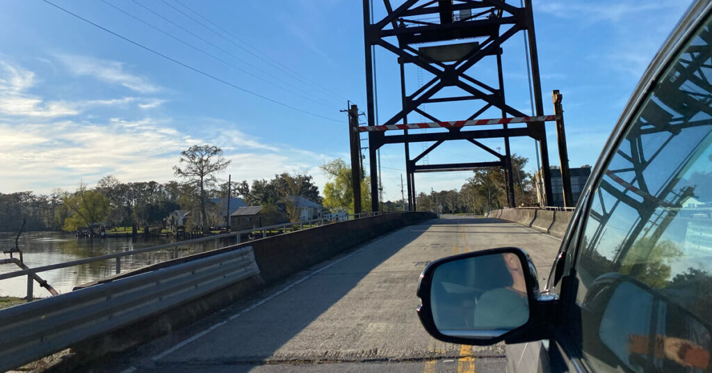 Car Insurance Louisiana - An image of a car going across a bridge