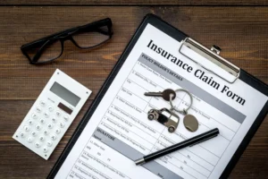 Does liability insurance cover my car if I hit someone? - An image of a clipboard with an Insurance Claim Form.