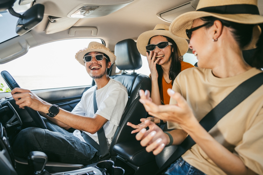 Short-term car insurance, an image of a group of people on a road-trip.