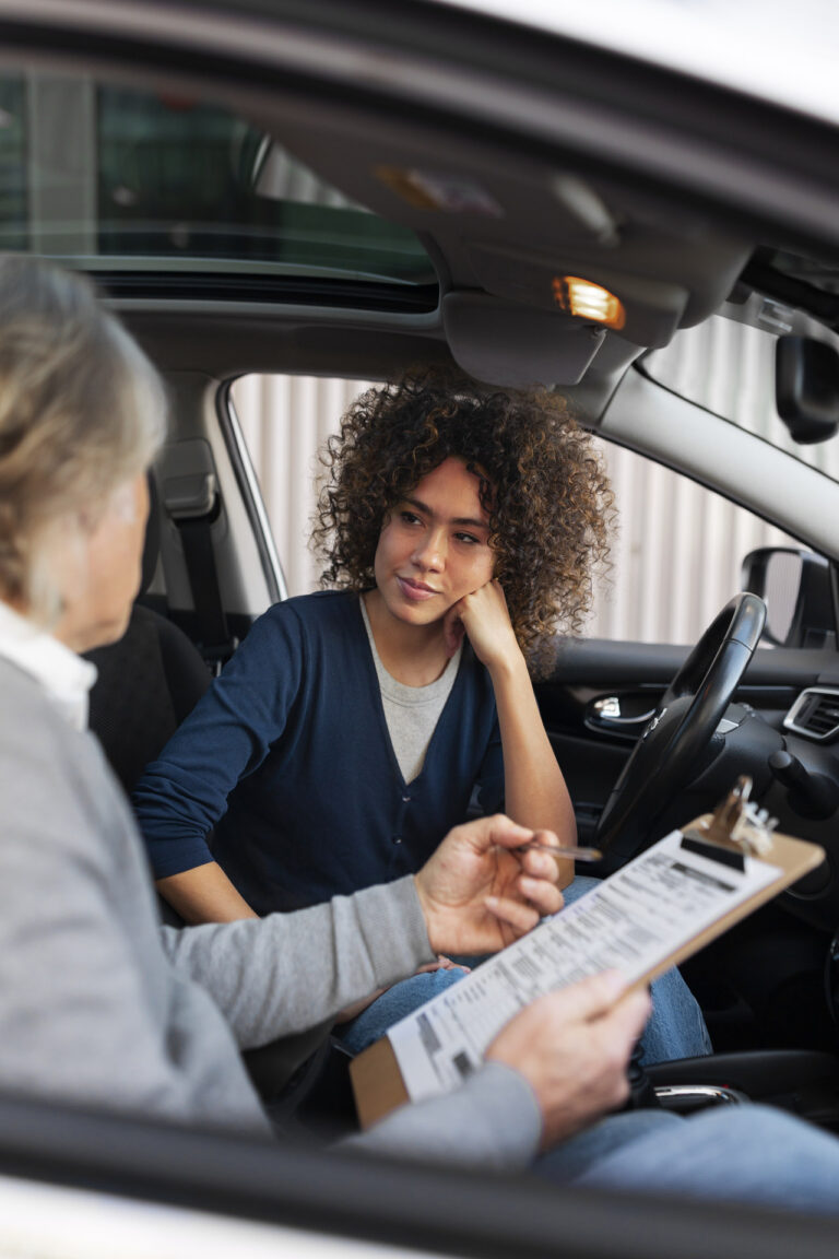 Student driver studying state traffic laws and preparing for a driver license examination