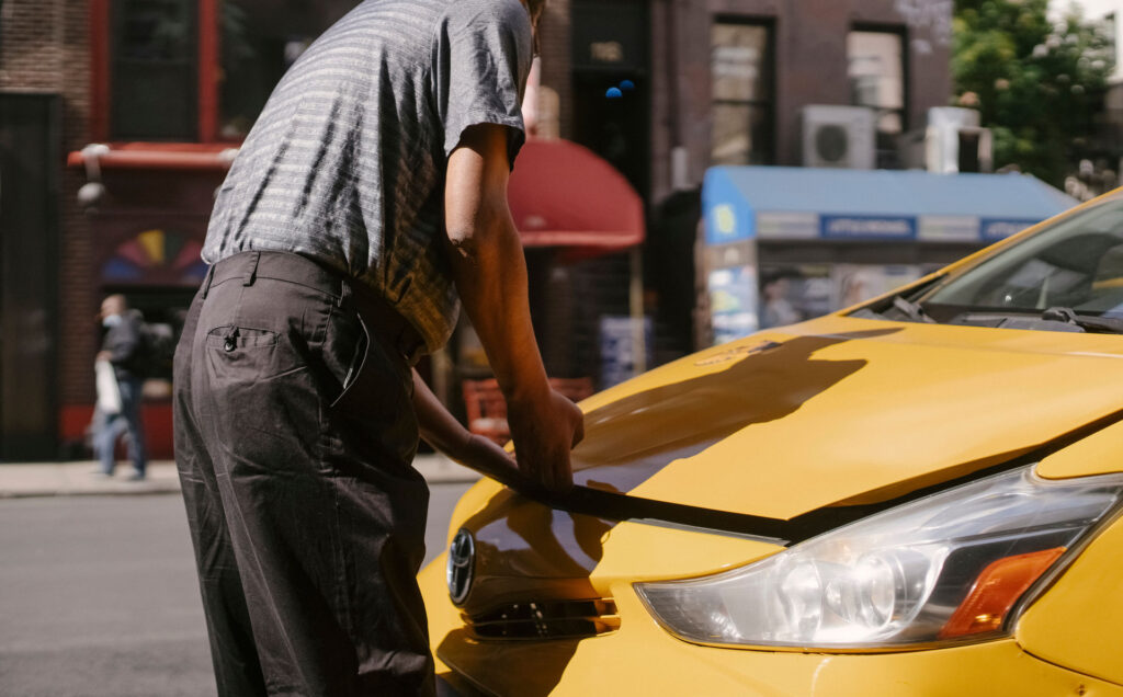 Driver holding state-minimum liability car insurance registration papers